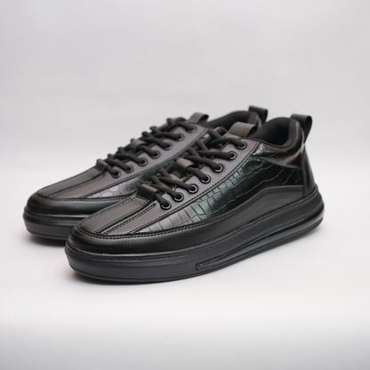 Black leather sneakers on a light gray background