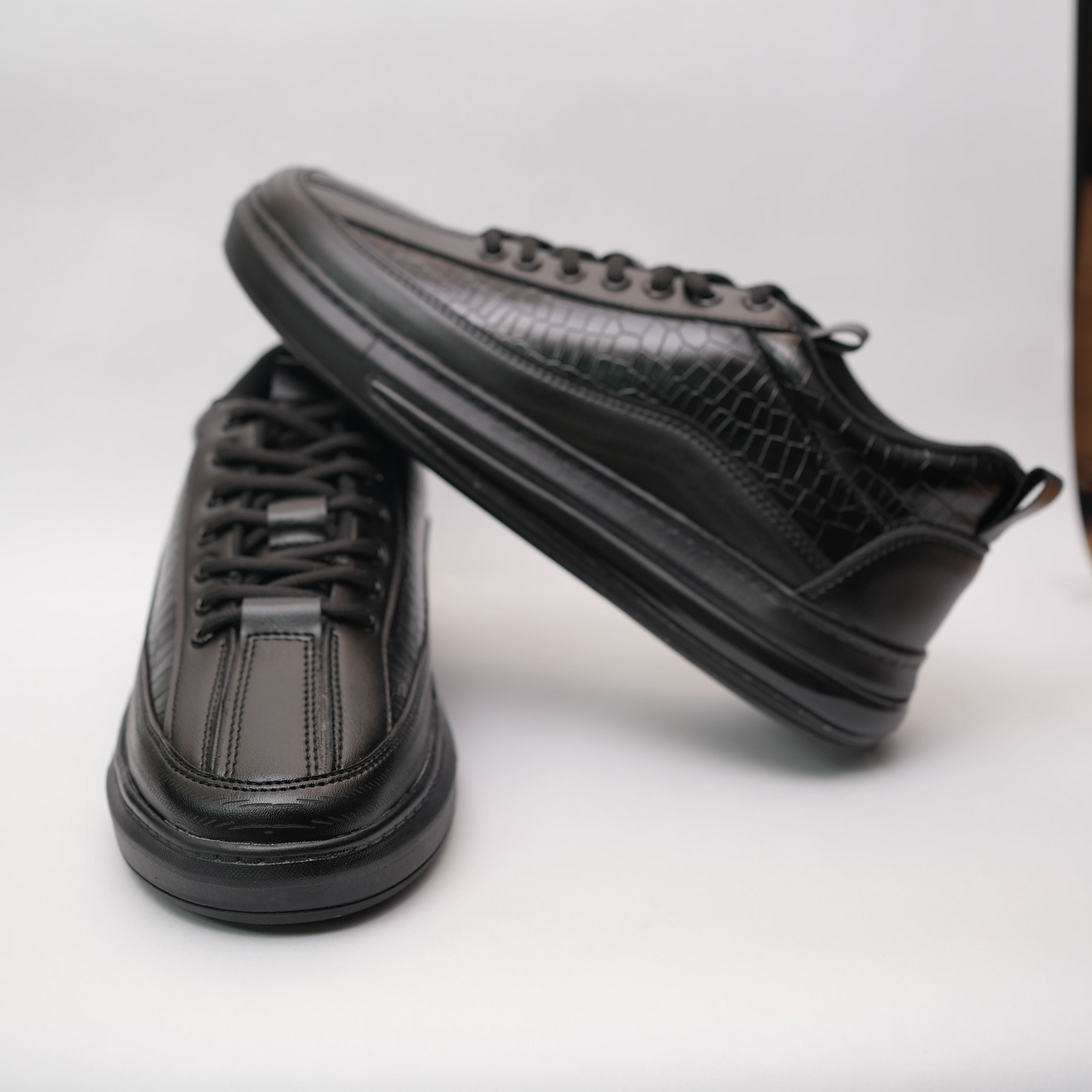 Black sneakers on a white background