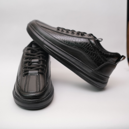 Black sneakers on a white background